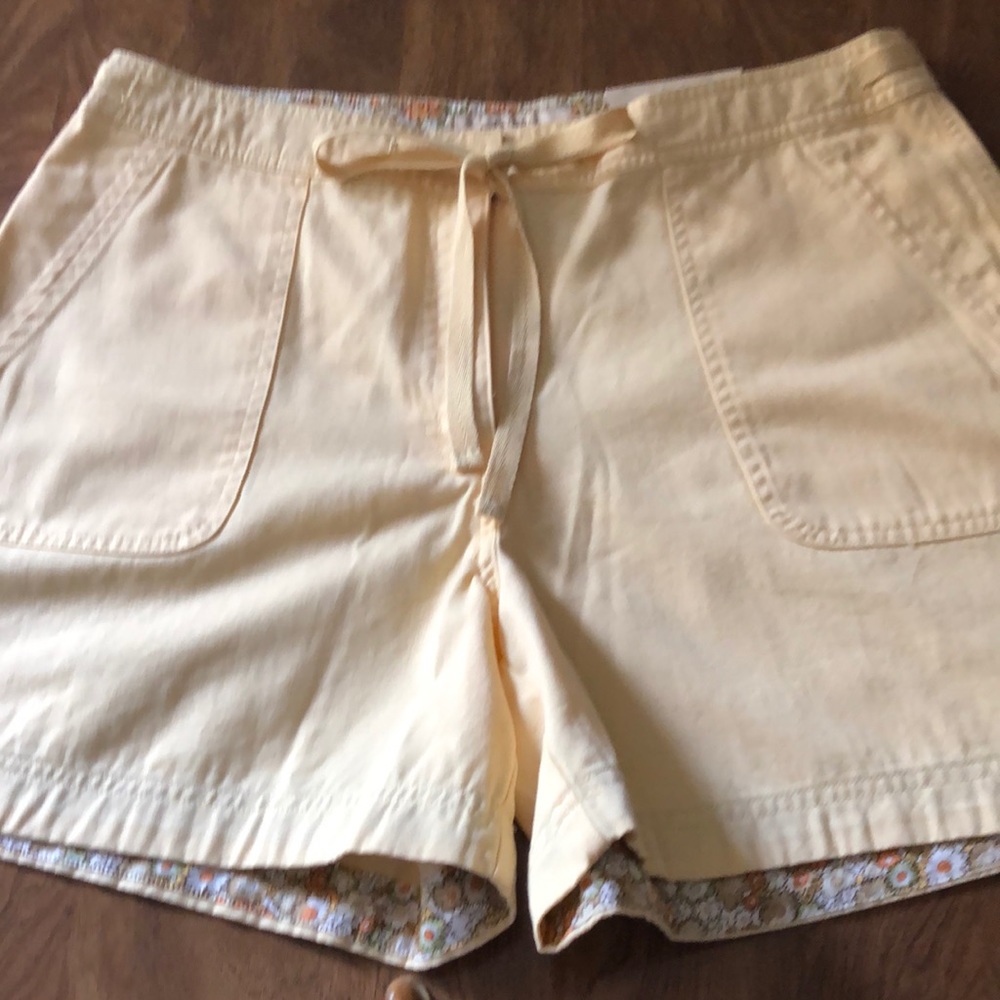 Pale yellow soft cotton shorts.